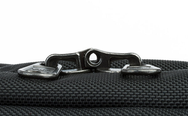 The locking zippers on a Black 525 Ballistic Western Flyer zipped shut to show the individual openings on each of the two zippers pairing together to create a slot for a travel lock.
